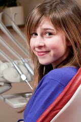 a smiling dental clinic patient