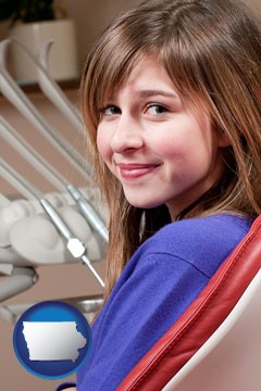 a smiling dental clinic patient - with Iowa icon