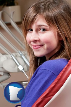 a smiling dental clinic patient - with Minnesota icon