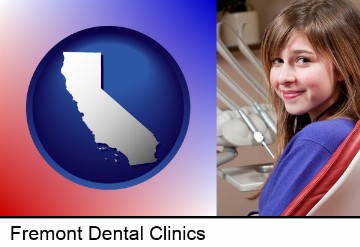 a smiling dental clinic patient in Fremont, CA