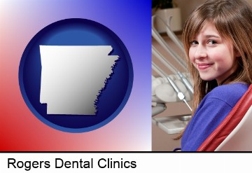 a smiling dental clinic patient in Rogers, AR